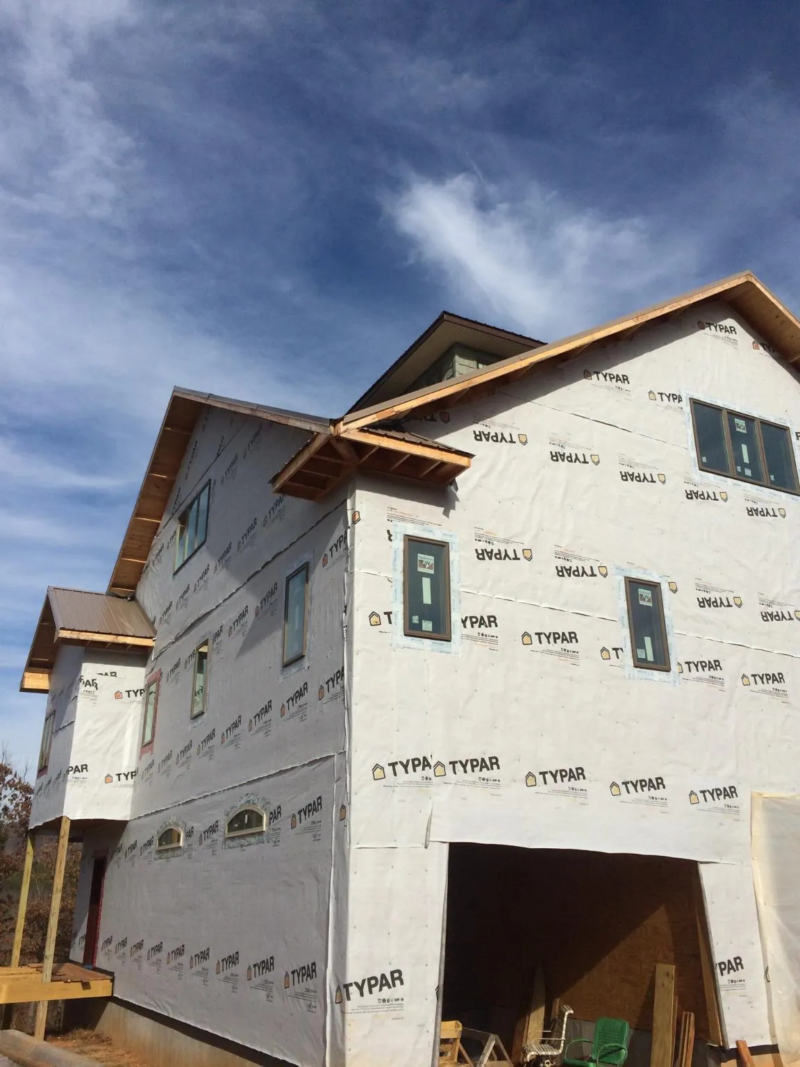Stick built house wrapped in Typar with new roof framing and dormers in Plains